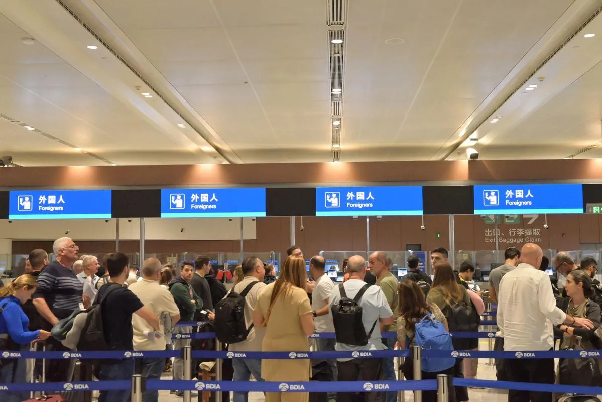 Foreigners going through customs at Beijing Daxing Airport