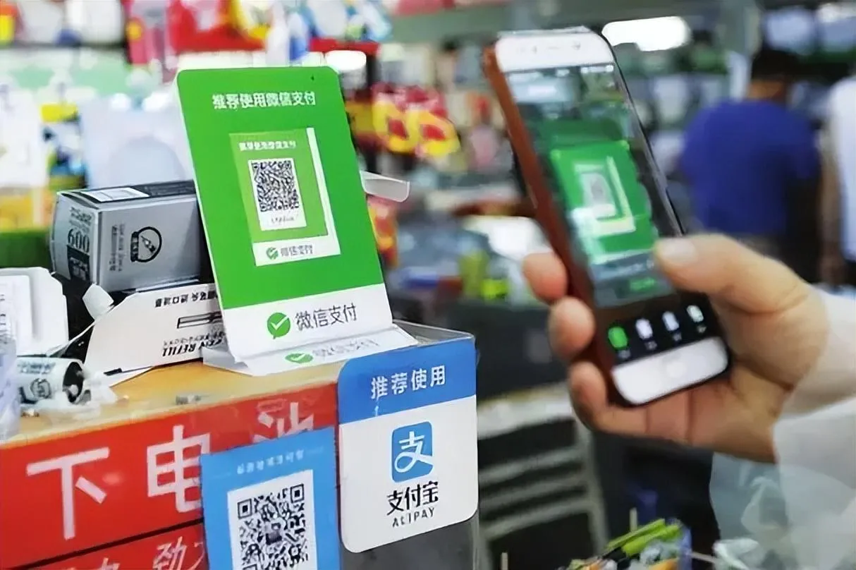 Scanning a WeChat Pay QR code at a shop counter